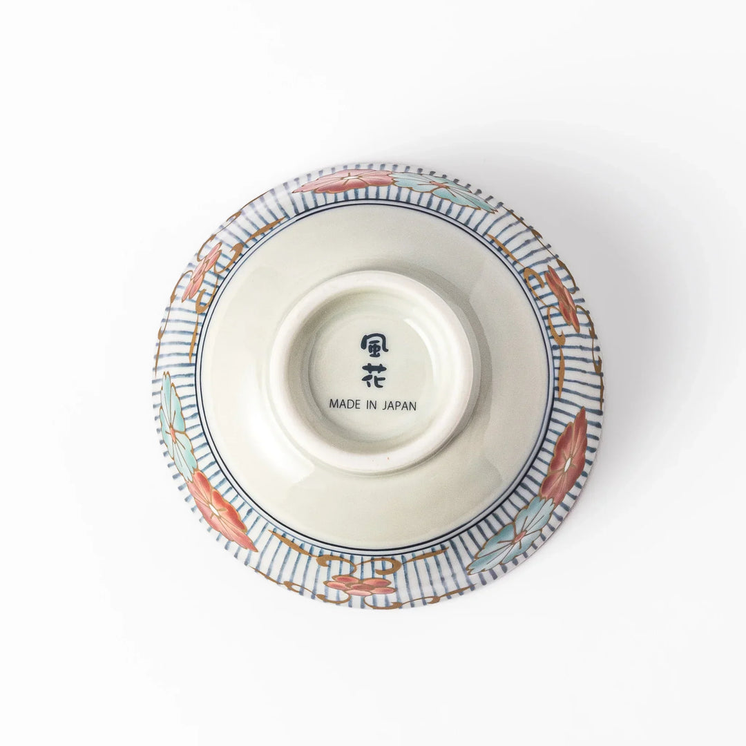 Traditional Japanese rice bowl with blue stripes and red teal and gold floral motifs perfect for bright everyday meals.