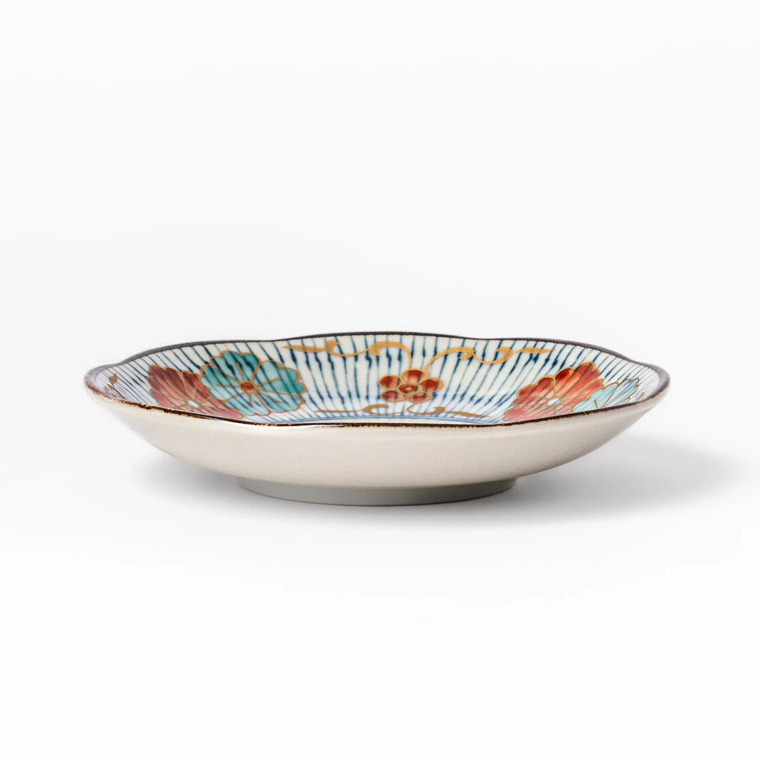 Scalloped Japanese sauce dish with blue stripes and red teal and gold motifs perfect for serving condiments.