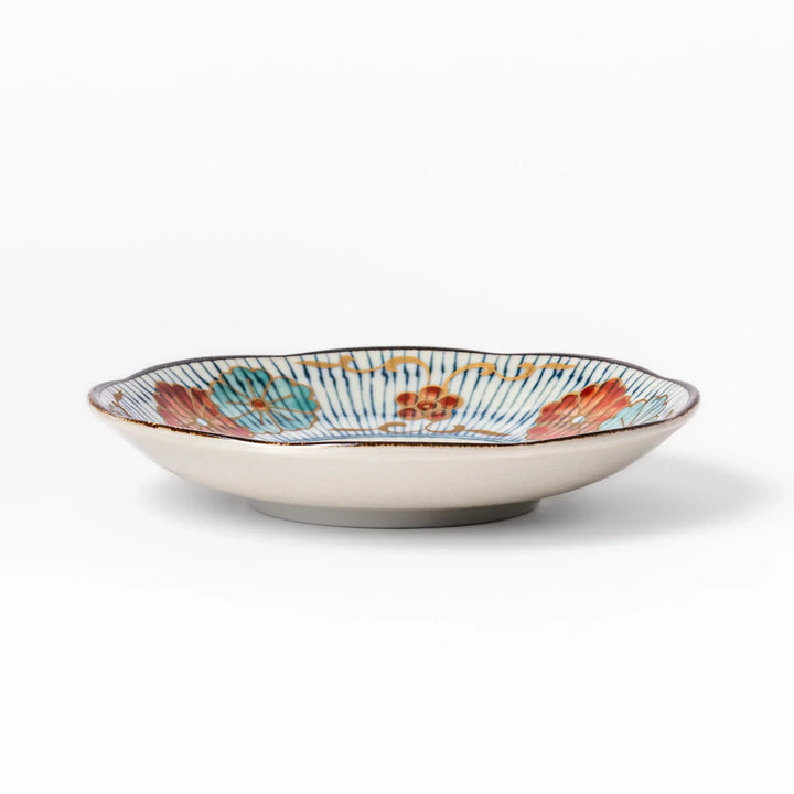 Scalloped Japanese sauce dish with blue stripes and red teal and gold motifs perfect for serving condiments.