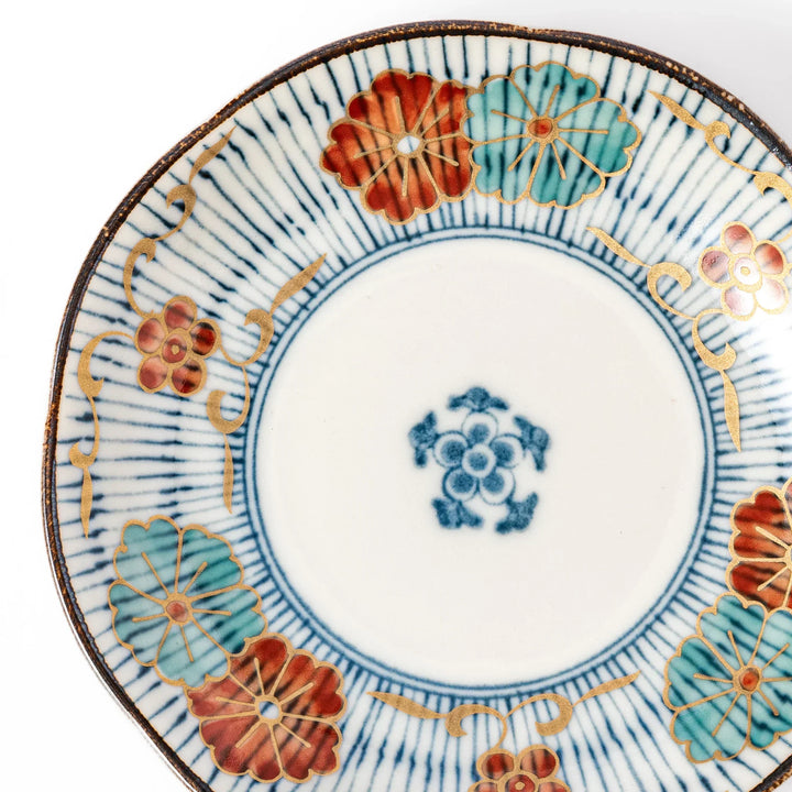 Scalloped Japanese sauce dish with blue stripes and red teal and gold motifs perfect for serving condiments.