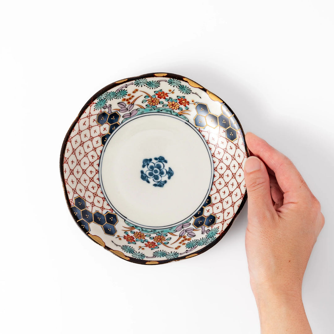 Scalloped Japanese dessert plate with red lattice navy hexagons and floral motifs perfect for elegant dining.