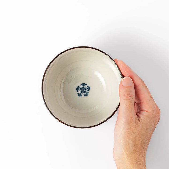 Traditional Japanese rice bowl with red lattice navy hexagons and floral motifs for elegant everyday dining.