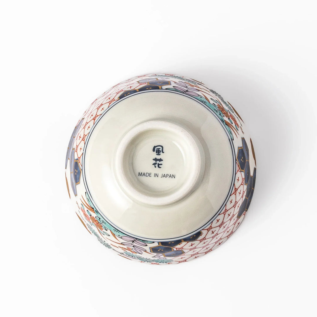 Traditional Japanese rice bowl with red lattice navy hexagons and floral motifs for elegant everyday dining.