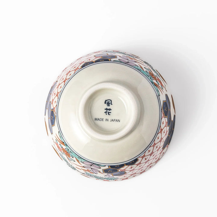 Traditional Japanese rice bowl with red lattice navy hexagons and floral motifs for elegant everyday dining.