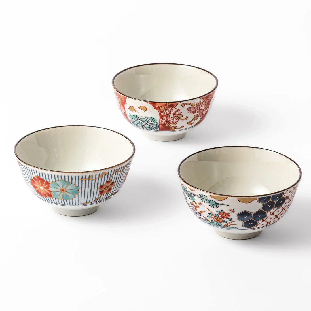 Set of three Japanese rice bowls with colorful floral wave and geometric patterns perfect for elegant meals.
