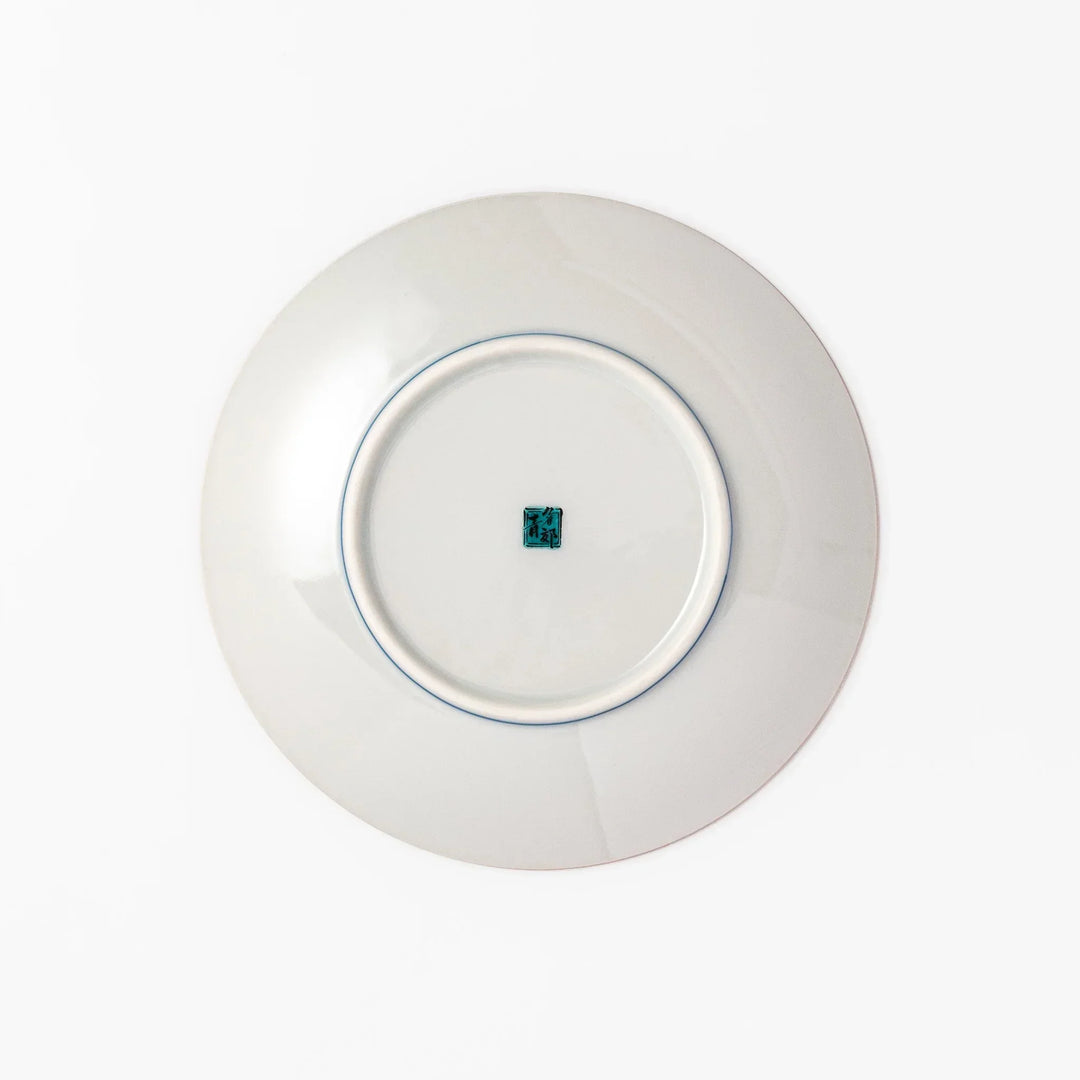 Round Kutani dessert plate with a bold golden leaf and grape motif on a turquoise background patterned with black starbursts.