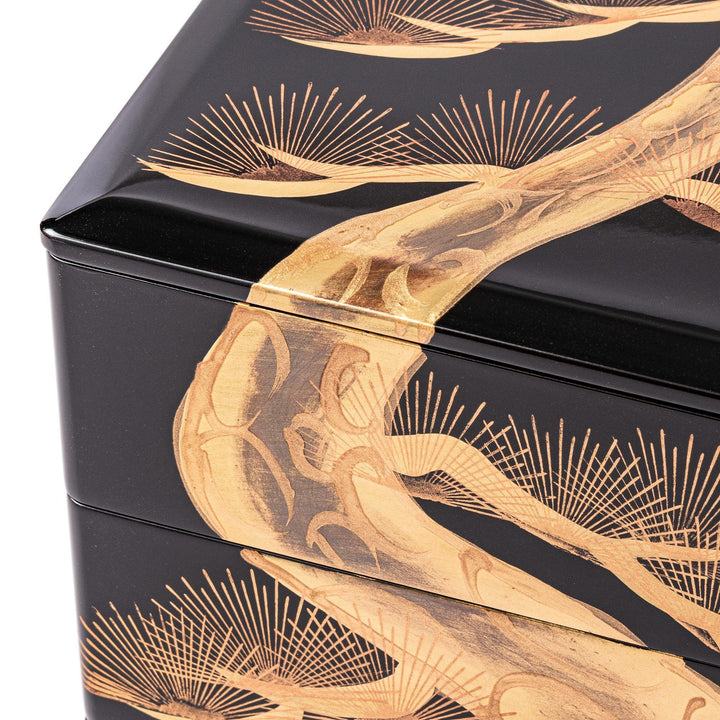 Golden Pine Japanese three tier jubako box with gold pine tree on black lacquer for festive occasions.