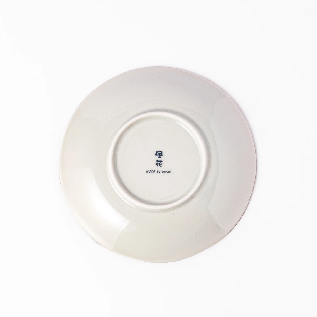 Elegant Japanese dessert plate with scalloped edge blue floral center and red gold and green patterns for refined dining.