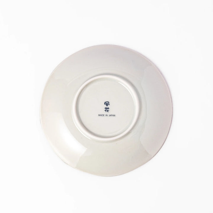 Elegant Japanese dessert plate with scalloped edge blue floral center and red gold and green patterns for refined dining.