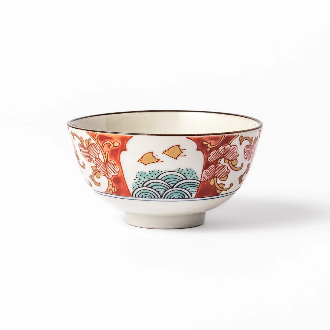 Traditional Japanese rice bowl with red green and gold motifs featuring waves florals and birds for refined meals.