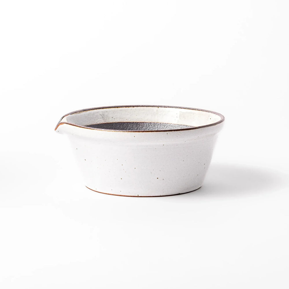 White Japanese ceramic suribachi bowl with smooth dark interior and spout for elegant effortless grinding.