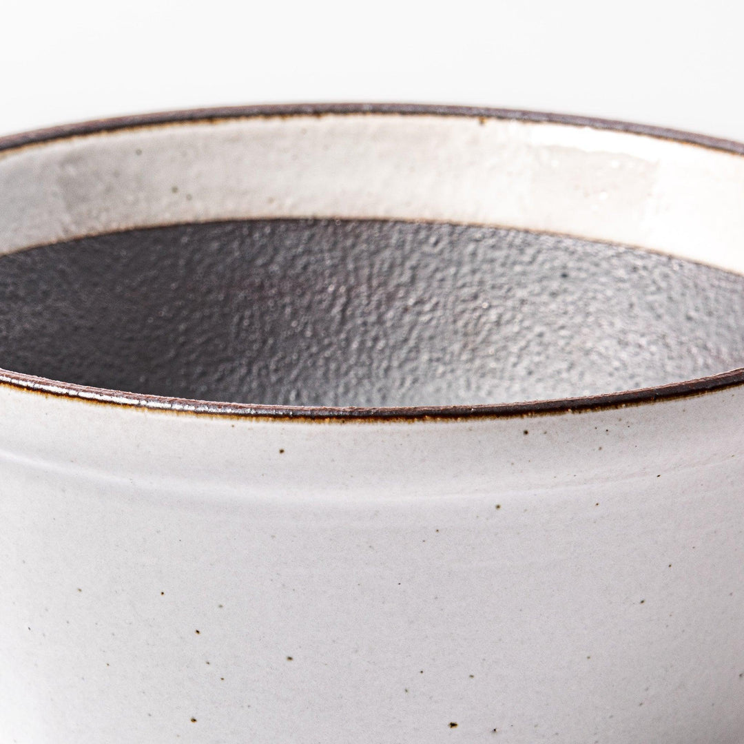 White Japanese ceramic suribachi bowl with smooth dark interior and spout for elegant effortless grinding.