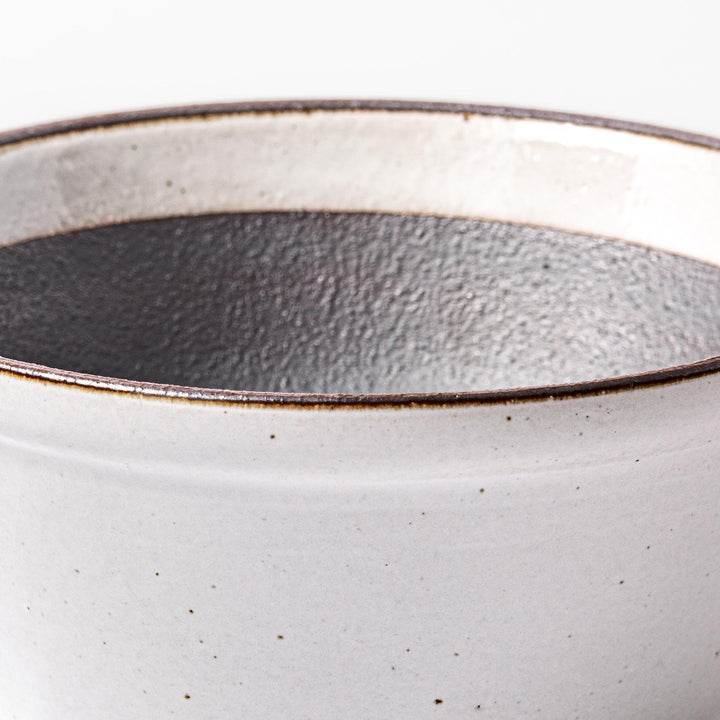 White Japanese ceramic suribachi bowl with smooth dark interior and spout for elegant effortless grinding.