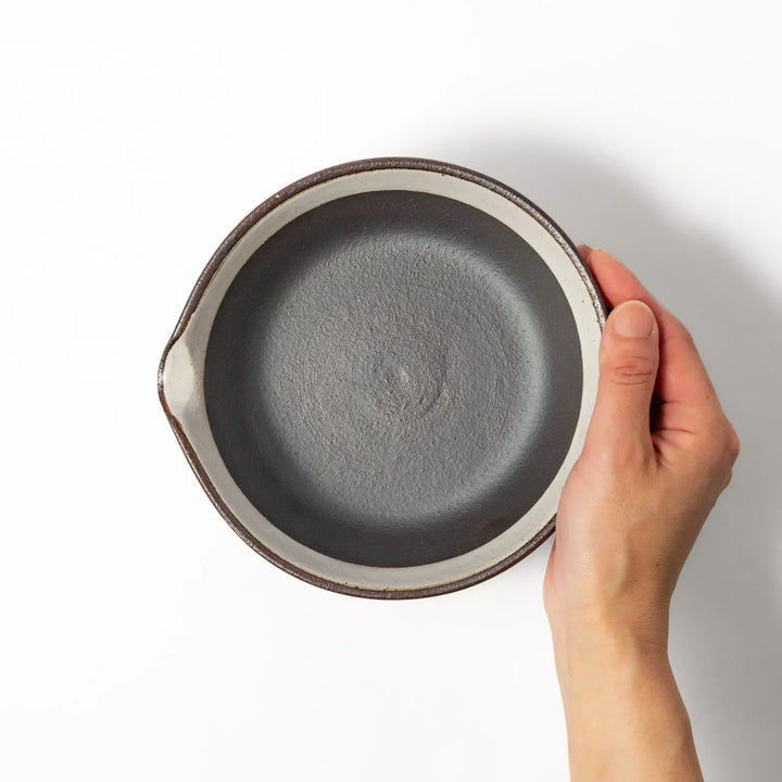 White Japanese ceramic suribachi bowl with smooth dark interior and spout for elegant effortless grinding.