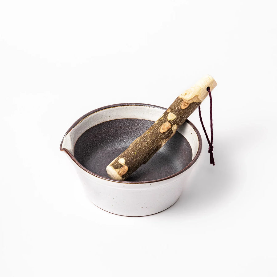 White Japanese ceramic suribachi bowl with smooth dark interior and spout for effortless elegant grinding.