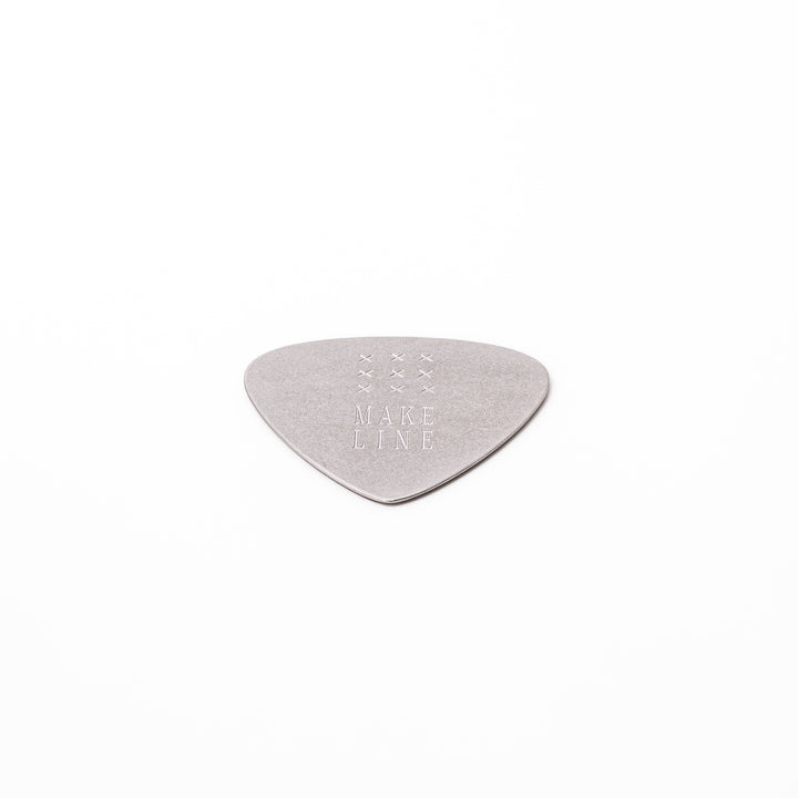 Unique guitar pick shaped metal coaster with vintage matte finish engraved with make line text and cross patterns
