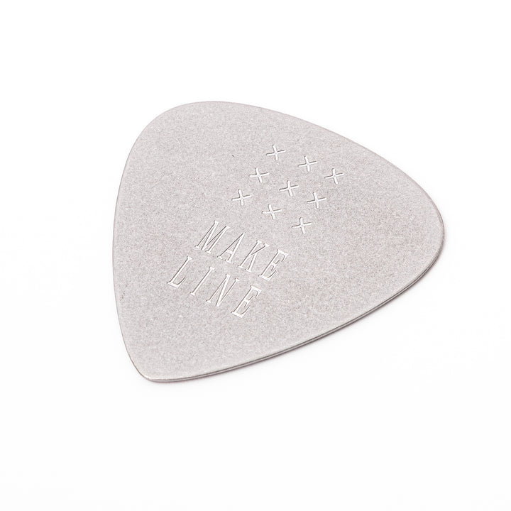 Unique guitar pick shaped metal coaster with vintage matte finish engraved with make line text and cross patterns