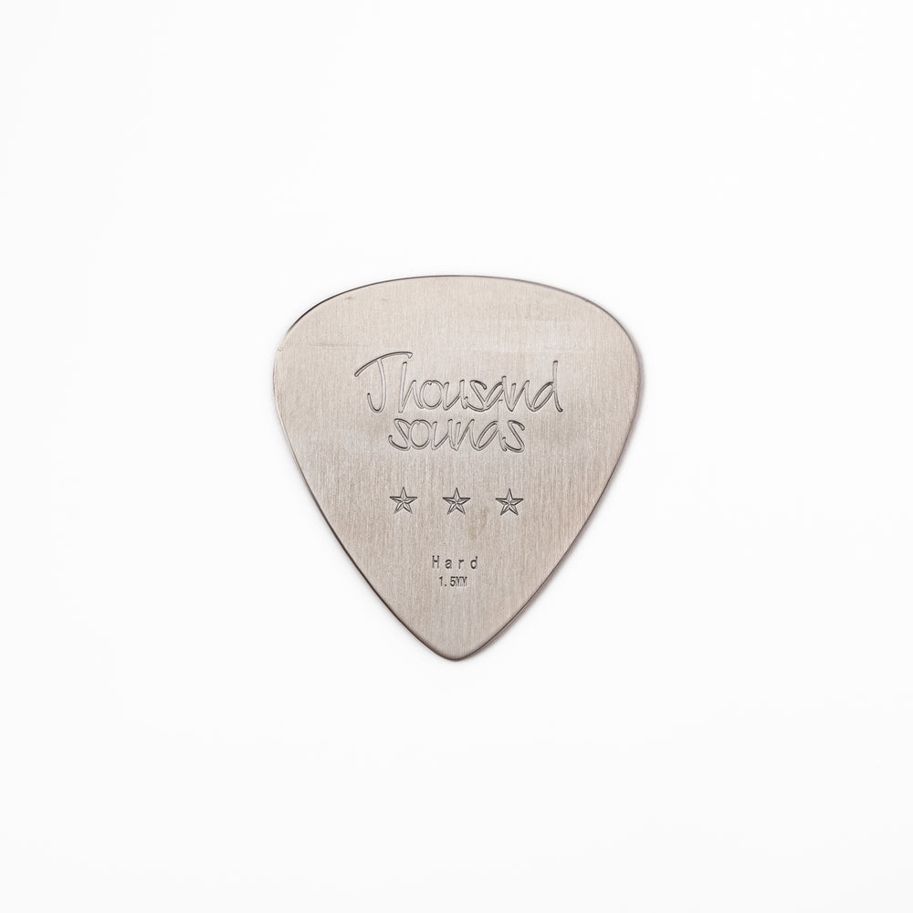 Unique guitar pick shaped stainless steel metal coaster engraved with thousand sounds text and stars