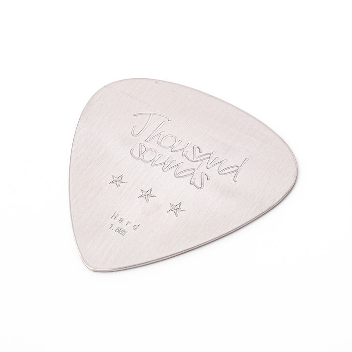 Unique guitar pick shaped stainless steel metal coaster engraved with thousand sounds text and stars