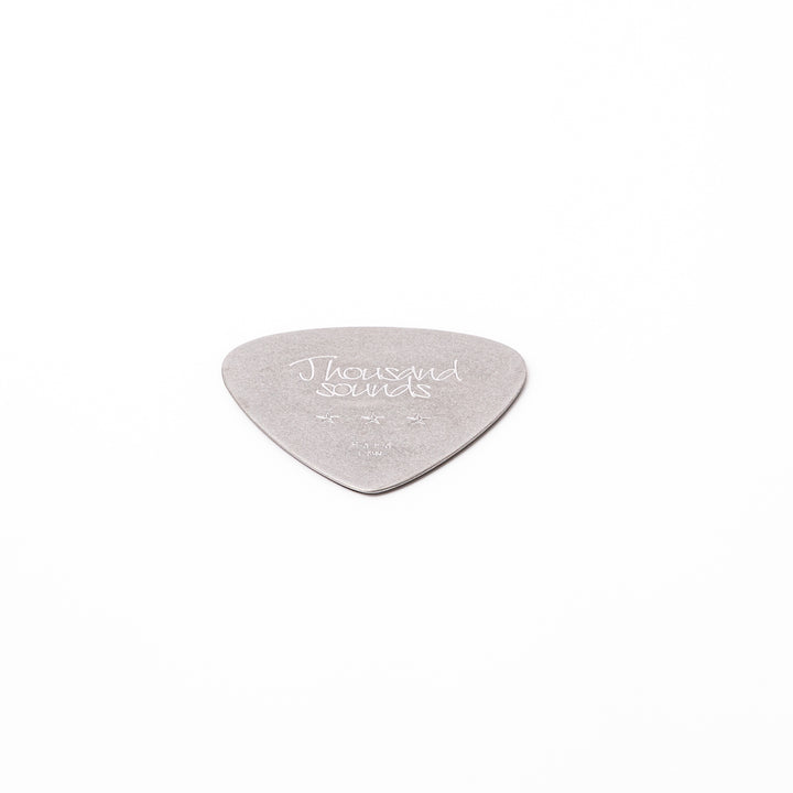 Unique guitar pick shaped metal coaster with vintage matte finish engraved with thousand sounds text and stars