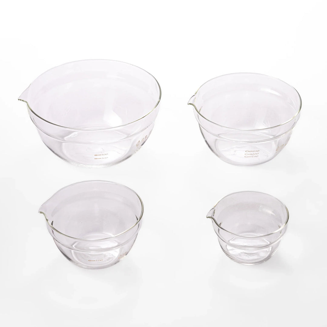 Set of four HARIO heat resistant glass mixing bowls with pour spouts, featuring various nested sizes for easy meal prep