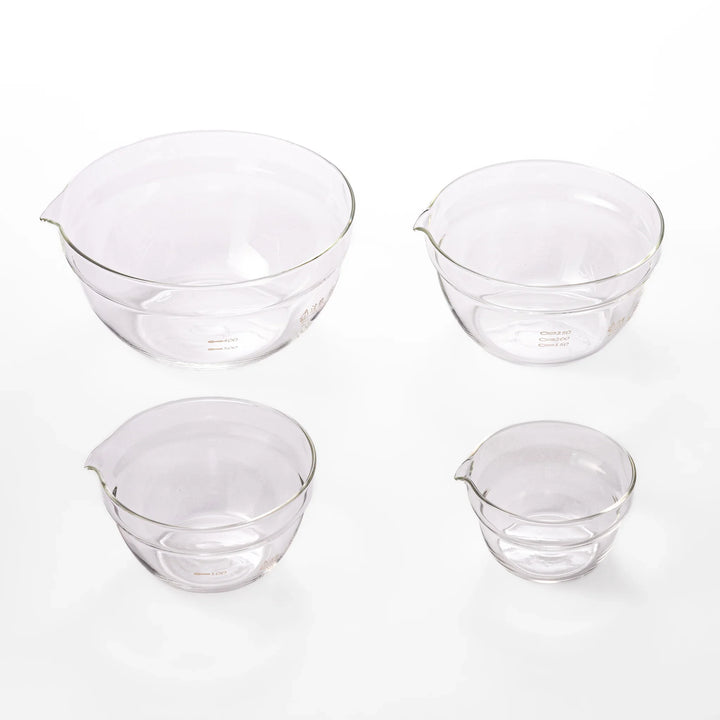 Set of four HARIO heat resistant glass mixing bowls with pour spouts, featuring various nested sizes for easy meal prep