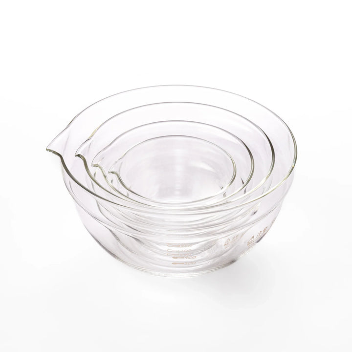 Set of four HARIO heat resistant glass mixing bowls with pour spouts, featuring various nested sizes for easy meal prep