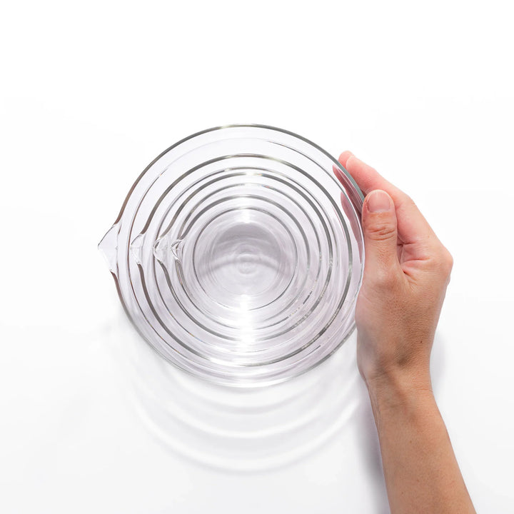 Set of four HARIO heat resistant glass mixing bowls with pour spouts, featuring various nested sizes for easy meal prep