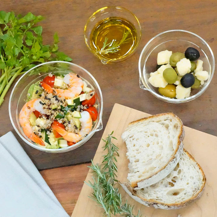 Showcasing fresh shrimp salad in hario heatproof glass lip bowl served with sliced bread olives and olive oil