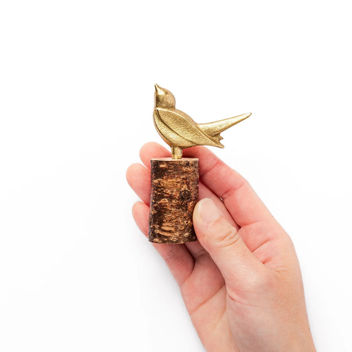 Golden Japanese brass sake cup with rounded base and hammered texture for refined traditional drinking.