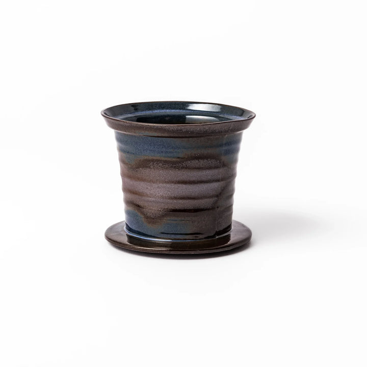 Handcrafted ceramic coffee dripper in brown and blue glaze with mesh filter for single serve brewing.
