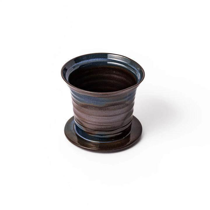 Handcrafted ceramic coffee dripper in brown and blue glaze with mesh filter for single serve brewing.