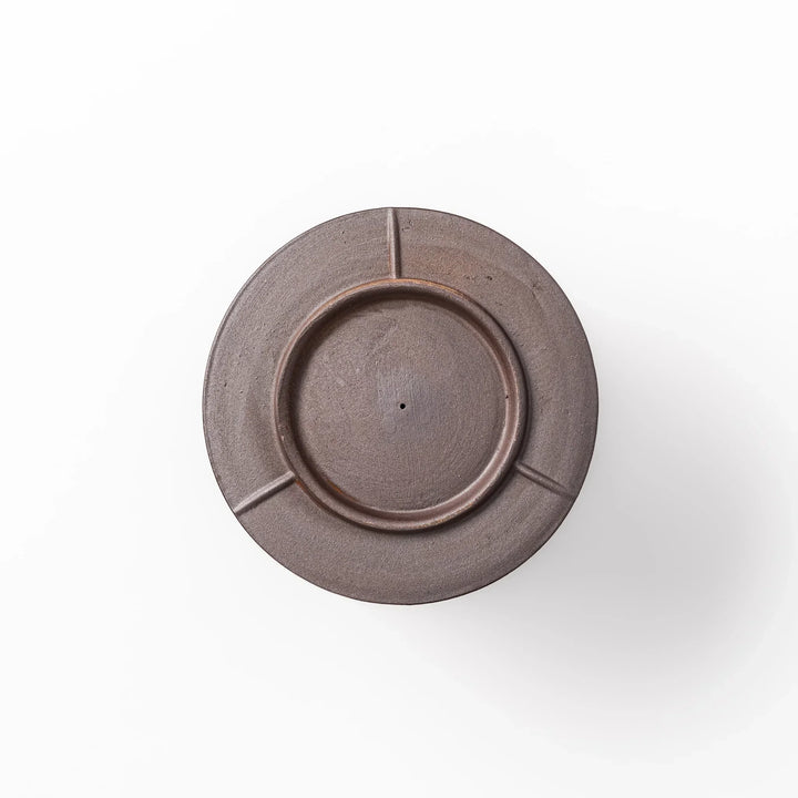Handcrafted ceramic coffee dripper in brown and blue glaze with mesh filter for single serve brewing.