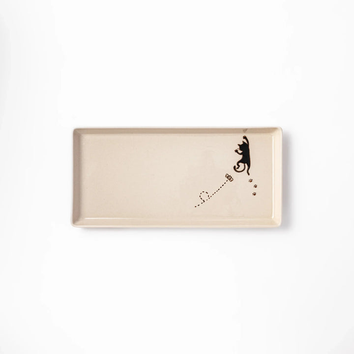 Beige rectangular ceramic plate featuring a playful black cat illustration with paw prints and a butterfly in the corner.