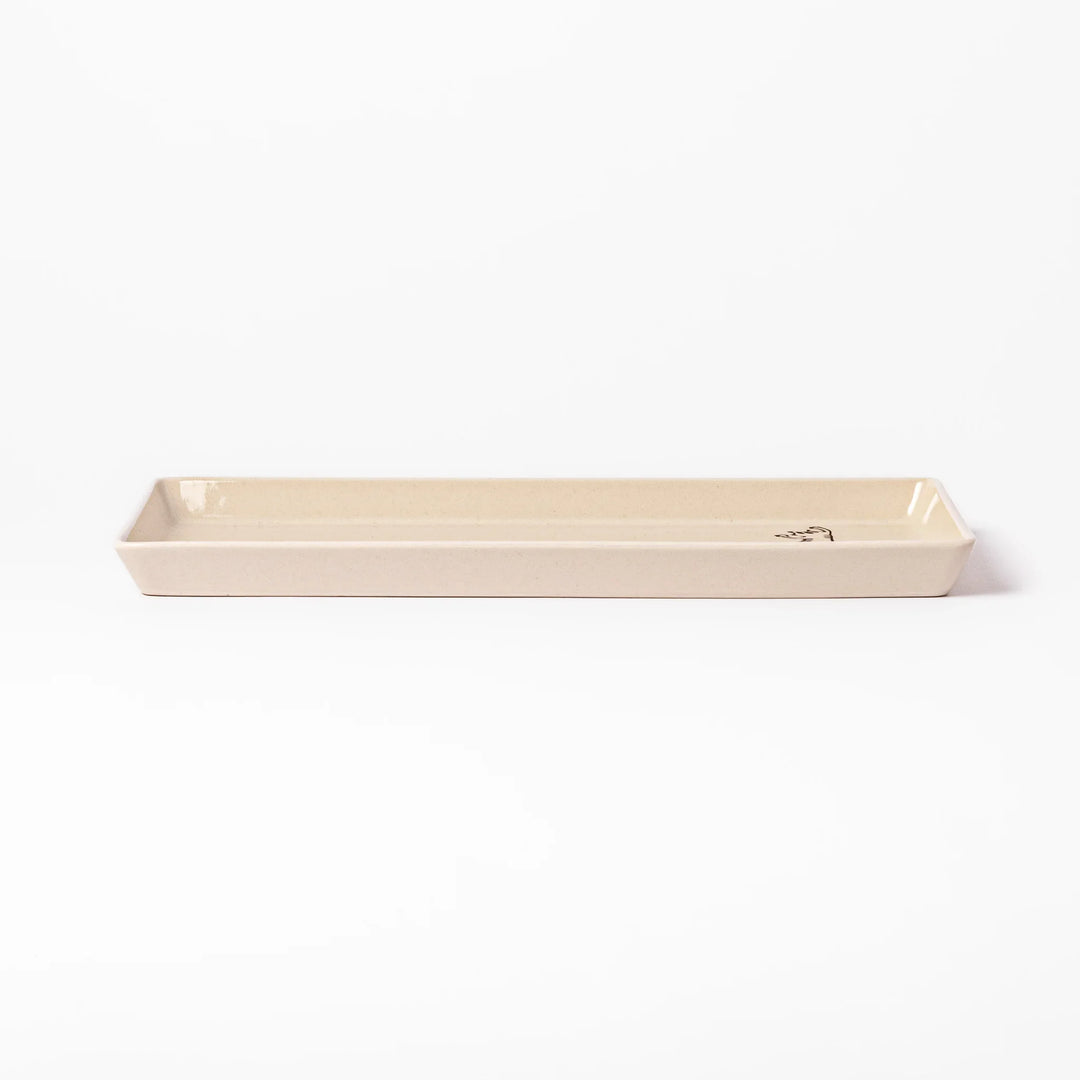 Beige rectangular ceramic plate featuring a playful tabby cat illustration with paw prints and a butterfly in the corner.