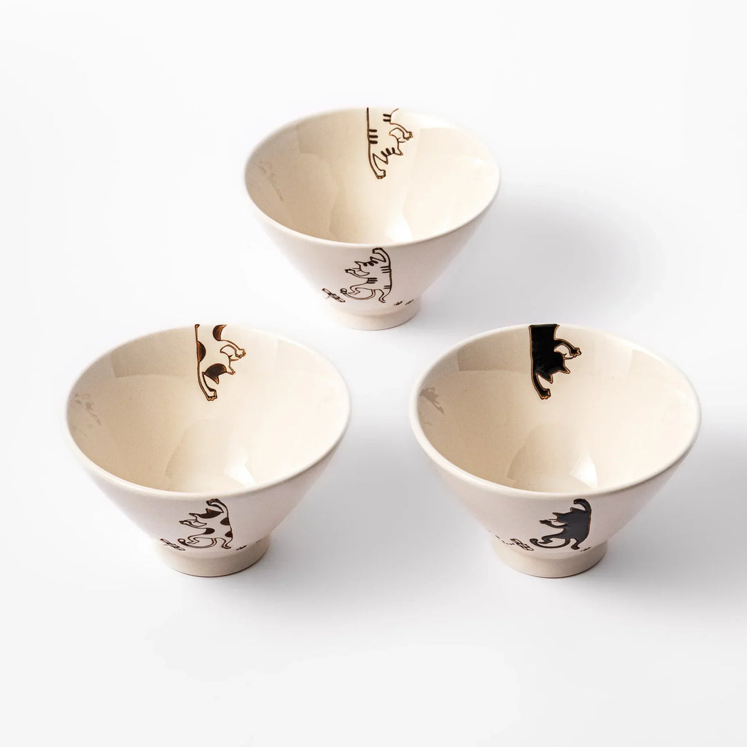 Set of three cream ceramic rice bowls with hanging cat designs in black calico and tabby with butterflies.