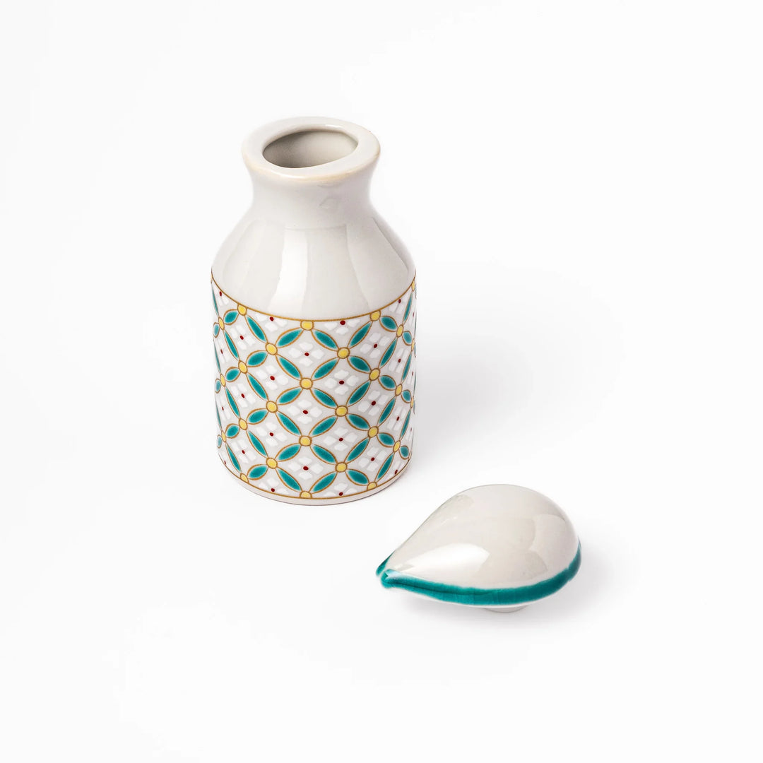 Japanese ceramic soy sauce dispenser with teal geometric blossom pattern in gold and red for refined dining.