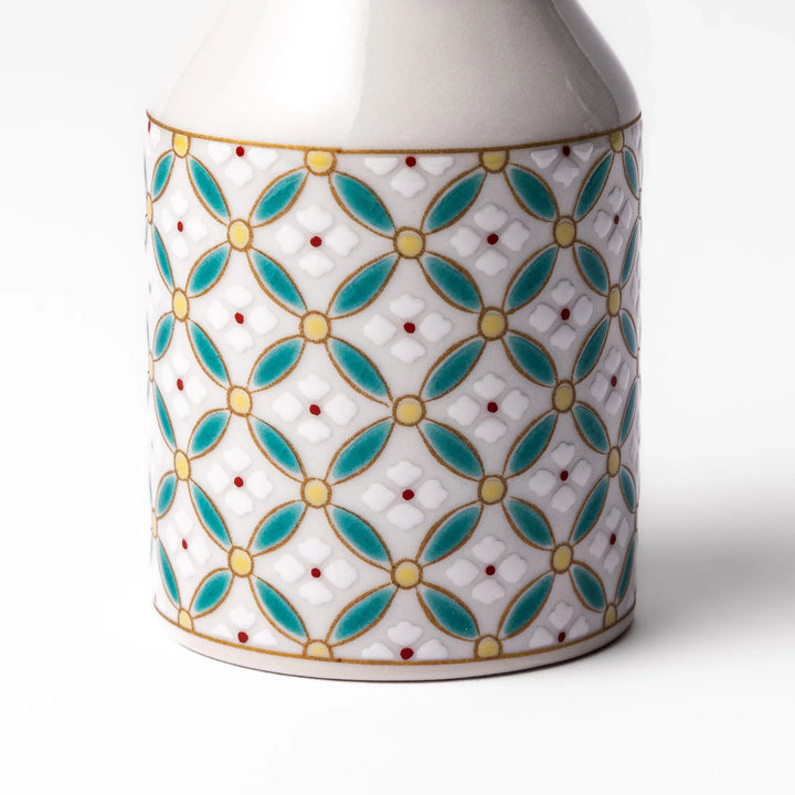 Japanese ceramic soy sauce dispenser with teal geometric blossom pattern in gold and red for refined dining.