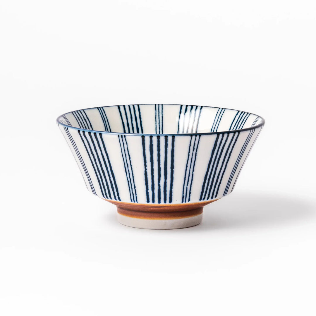Japanese porcelain rice bowl with fine indigo vertical stripes and terracotta base in minimalist design.