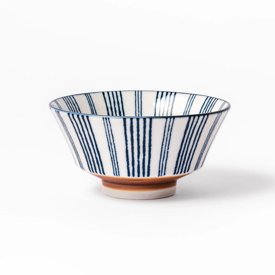 Japanese porcelain rice bowl with fine indigo vertical stripes and terracotta base in minimalist design.