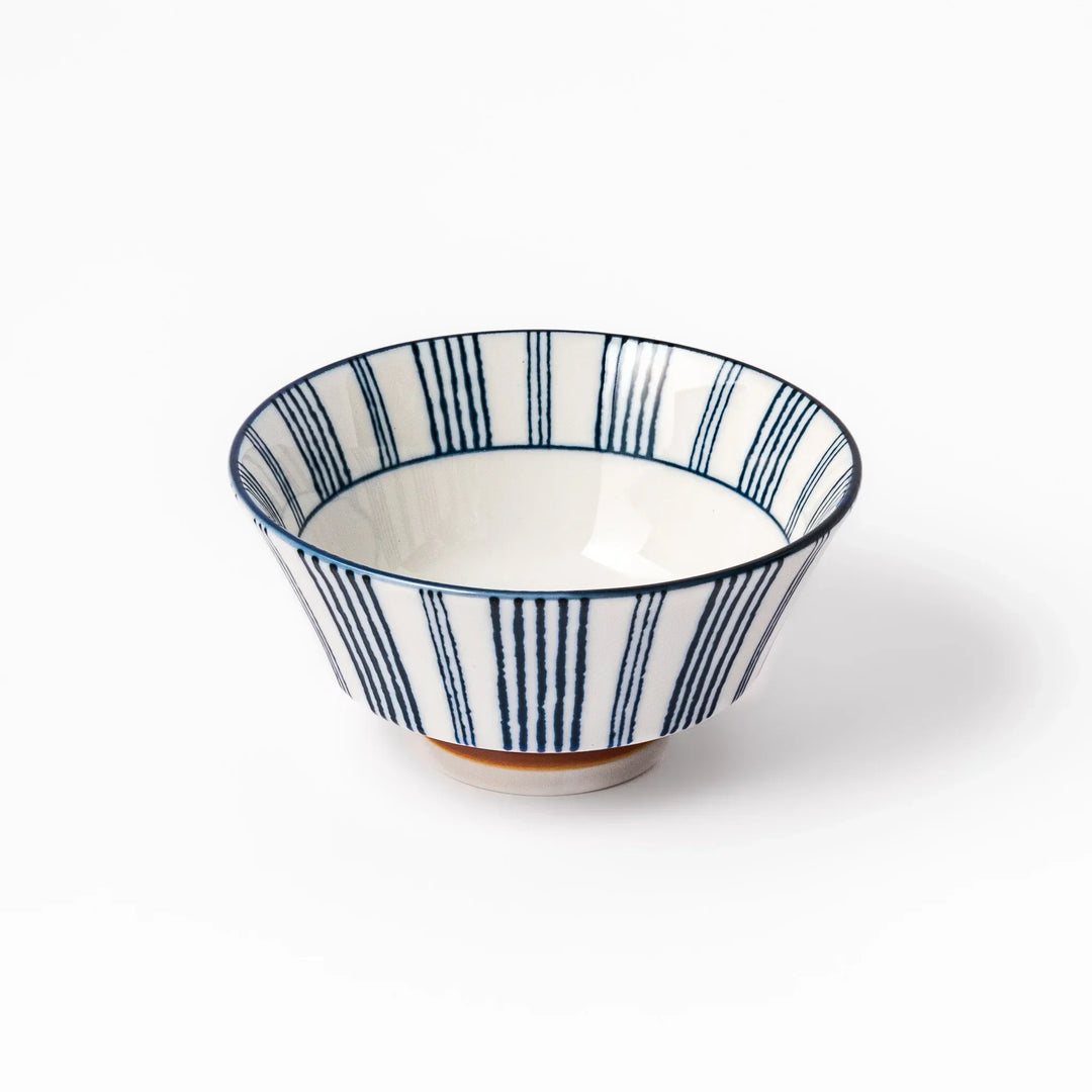 Japanese porcelain rice bowl with fine indigo vertical stripes and terracotta base in minimalist design.