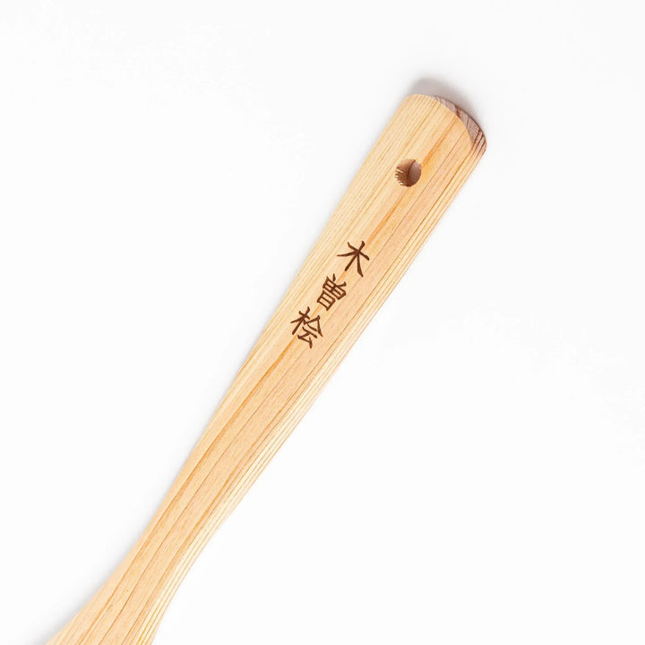 Hinoki Angled Large Wooden Spatula with engraved handle and smooth grain ideal for flipping and serving.