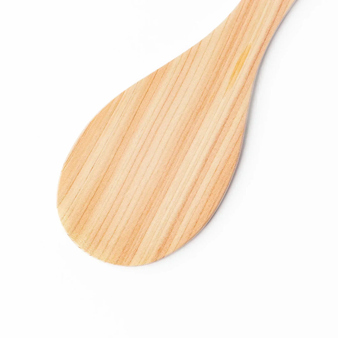 Japanese hinoki wood rice paddle with natural grain and engraved characters, lightweight and smooth for serving cooked rice