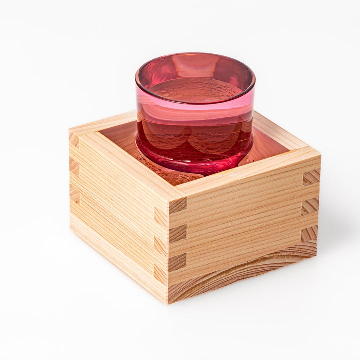 Pink sake glass with gold-leaf mountain and Mount Fuji base, perfect for festive and elegant occasions.