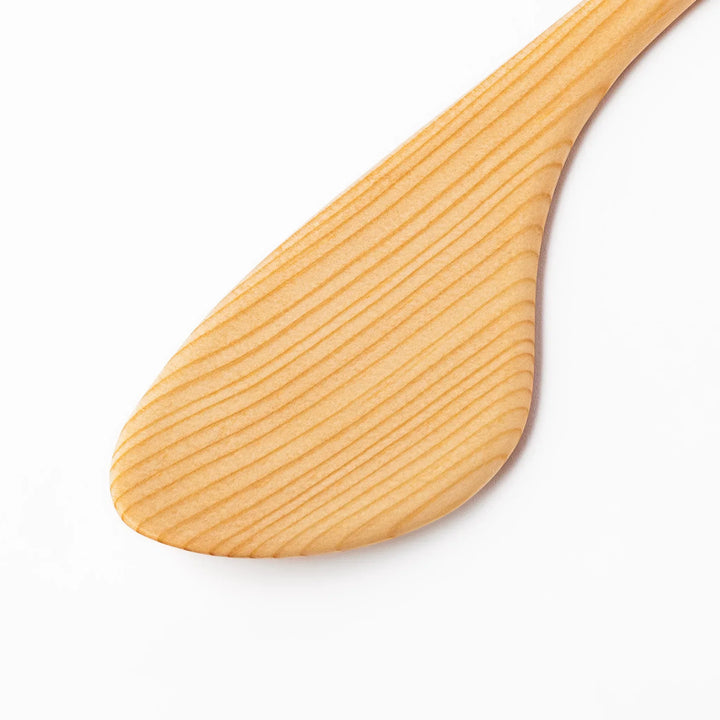 Lightweight hinoki wood spatula with fine grain and engraved Japanese handle for authentic kitchen use.