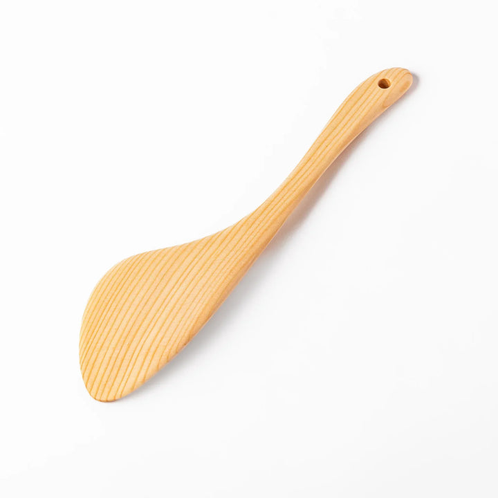 Lightweight hinoki wood spatula with fine grain and engraved Japanese handle for authentic kitchen use.