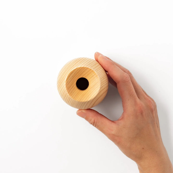 Hinoki wood sake set with carafe and two cups featuring burnt in designs for elegant Japanese sake rituals.