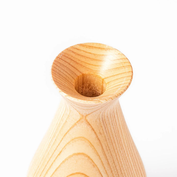 Hinoki wood sake set with carafe and two cups featuring burnt in designs for elegant Japanese sake rituals.