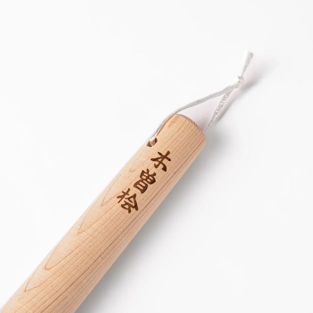 Hinoki wood pestle with engraved Japanese characters and cord for grinding seeds and spices with suribachi.