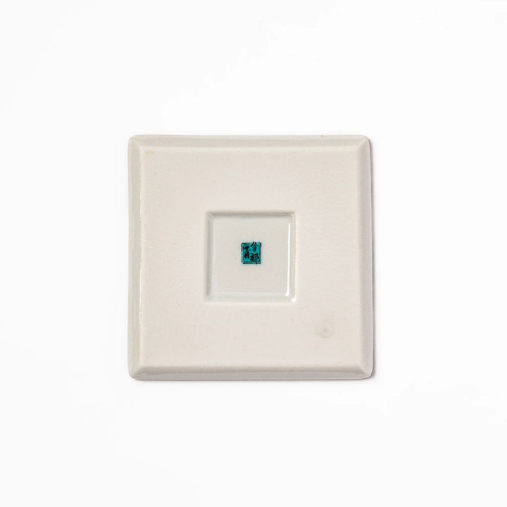 Square Japanese ceramic coaster with Hokusai Great Wave design featuring blue waves golden sky and Mt Fuji.